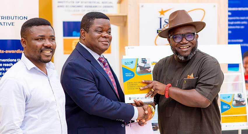 Panelist, Ing. Dr Kenneth Ashigbey, is presented with a copy of the report, as were several other special guests and institutions at the event.